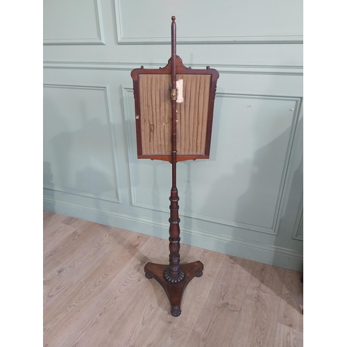 514 - William IV rosewood pole fire screen on single turned column raised on platform base and castors. {1... 