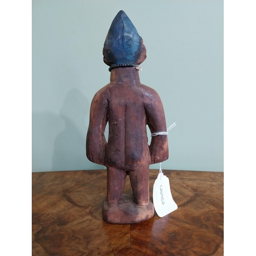 517 - Painted hardwood South Sea Totem. {21 cm H x 9 cm W x 5 cm D}.