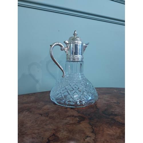 520 - Silver plate and moulded glass claret jug. {27 cm H x 19 cm Dia.}.