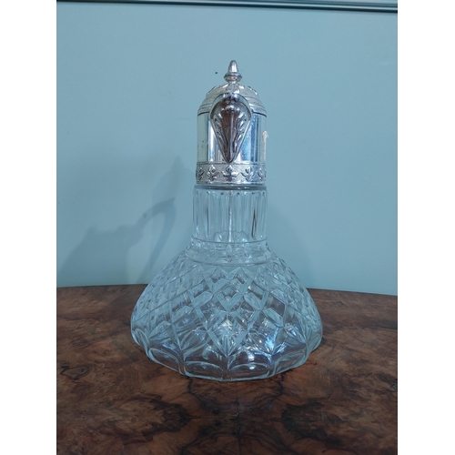 520 - Silver plate and moulded glass claret jug. {27 cm H x 19 cm Dia.}.