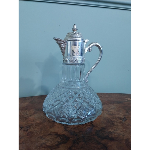 520 - Silver plate and moulded glass claret jug. {27 cm H x 19 cm Dia.}.