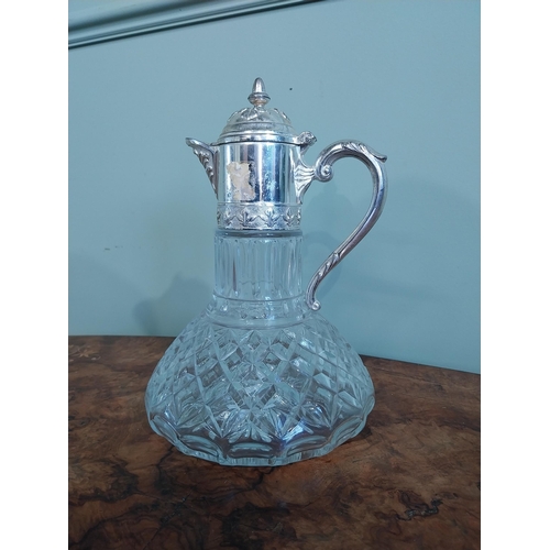 520 - Silver plate and moulded glass claret jug. {27 cm H x 19 cm Dia.}.