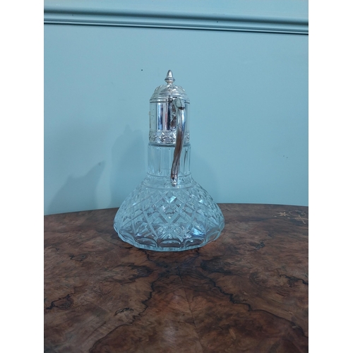 520 - Silver plate and moulded glass claret jug. {27 cm H x 19 cm Dia.}.