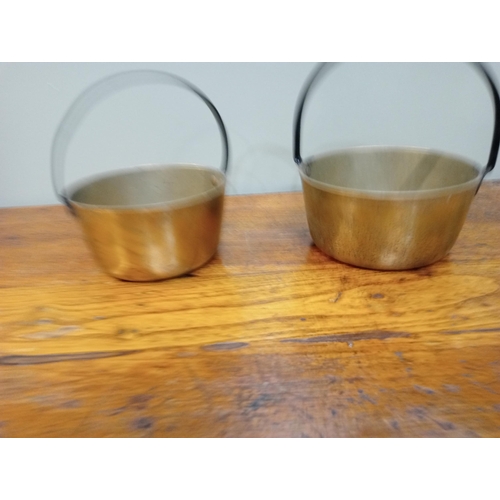 527 - Pair of brass preserving pans.  {H 24cm x Dia 20cm H 20cm x D 18cm