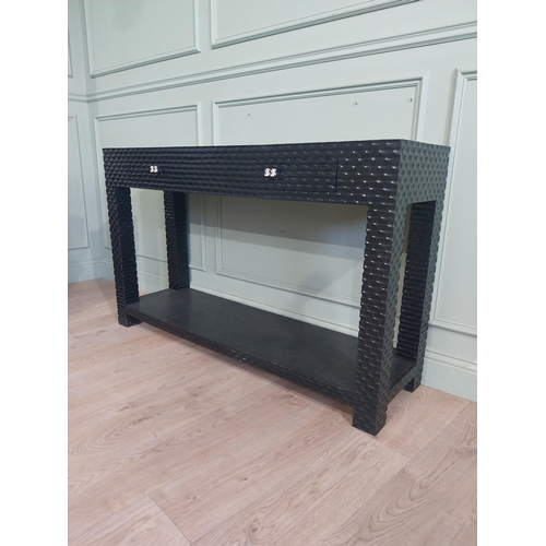 534 - Designer ebonised console table with two drawers in frieze with platform base and square legs. {85 c... 