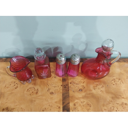 54 - Collection of Victorian ruby glass � Lidded jug, decanter, two sugar sifters and jug. {24 cm H  to 1... 