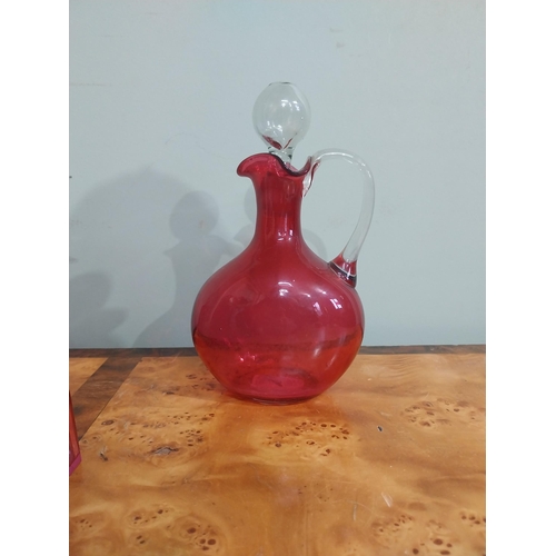 54 - Collection of Victorian ruby glass � Lidded jug, decanter, two sugar sifters and jug. {24 cm H  to 1... 