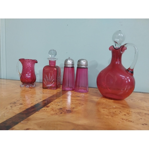 54 - Collection of Victorian ruby glass � Lidded jug, decanter, two sugar sifters and jug. {24 cm H  to 1... 