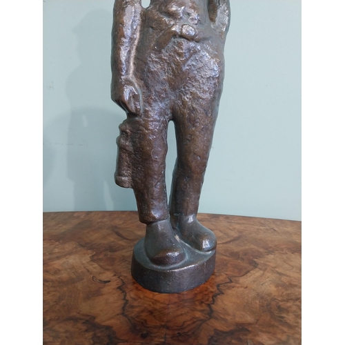 540 - Bronze doorstop in the form of a Miner. {40 cm H x 13 cm W x 7 cm D}.