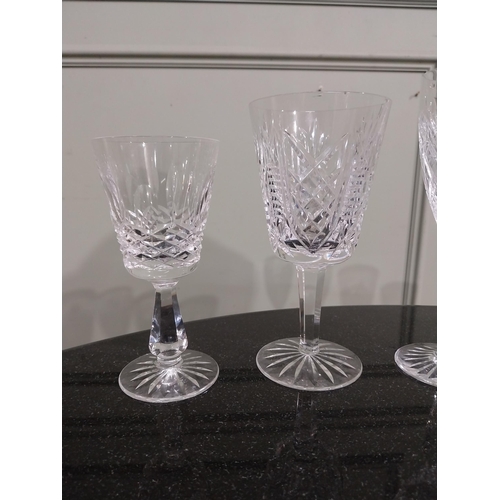 542 - Six cut crystal wine glasses including some Waterford. {18 cm H to 15 cm H}