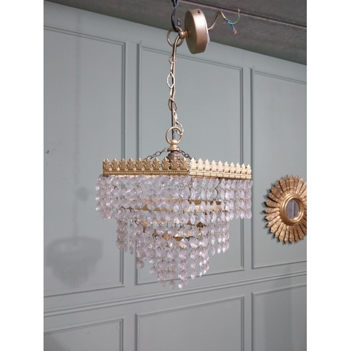 547 - 1950�s French gilded brass and crystal drop three tier chandelier. {54 cm H x 27 cm Dia.}.