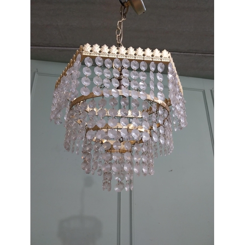 547 - 1950�s French gilded brass and crystal drop three tier chandelier. {54 cm H x 27 cm Dia.}.