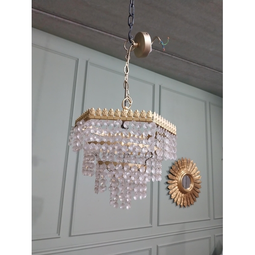 547 - 1950�s French gilded brass and crystal drop three tier chandelier. {54 cm H x 27 cm Dia.}.