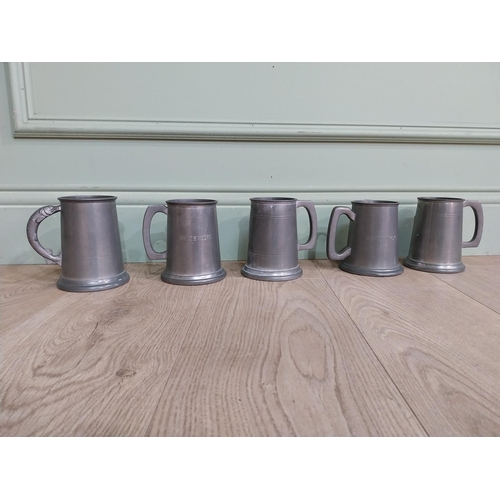 548 - Five pewter tankards one with fishing reference �the one that got away�. {13 cm H x 12 cm Dia.}.