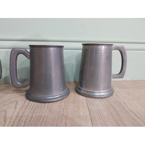 548 - Five pewter tankards one with fishing reference �the one that got away�. {13 cm H x 12 cm Dia.}.