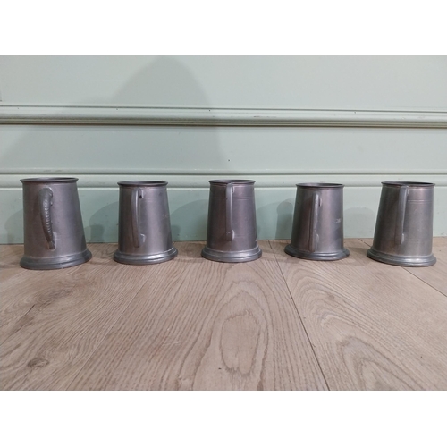 548 - Five pewter tankards one with fishing reference �the one that got away�. {13 cm H x 12 cm Dia.}.