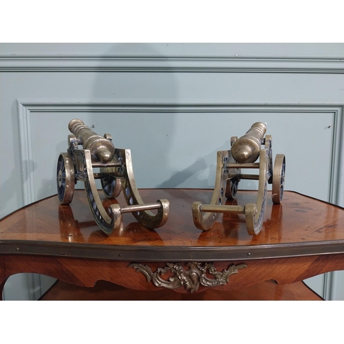 557 - Pair of good quality brass desk cannons. {20 cm H x 43 cm W x 13 cm D}.