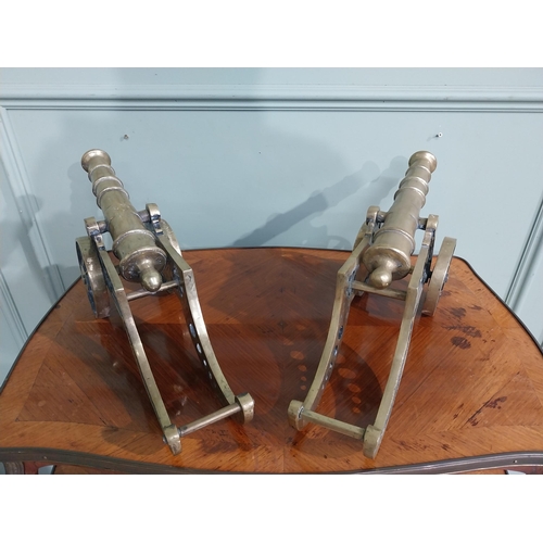 557 - Pair of good quality brass desk cannons. {20 cm H x 43 cm W x 13 cm D}.