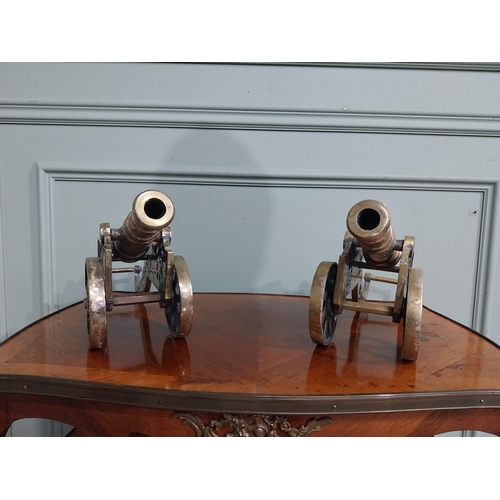 557 - Pair of good quality brass desk cannons. {20 cm H x 43 cm W x 13 cm D}.