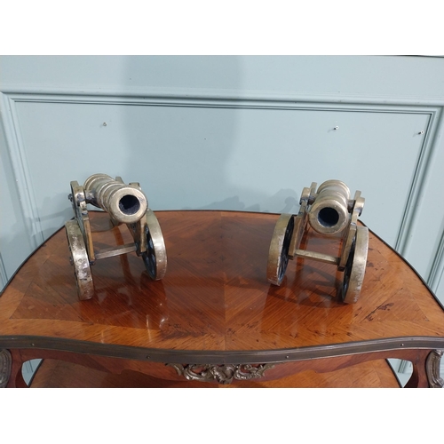 557 - Pair of good quality brass desk cannons. {20 cm H x 43 cm W x 13 cm D}.