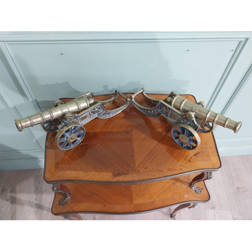 557 - Pair of good quality brass desk cannons. {20 cm H x 43 cm W x 13 cm D}.