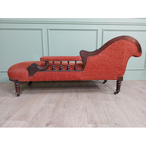 559 - 19th C. Carved mahogany and upholstered chaise longue on turned legs and castors. {80 cm H x 195 cm ... 