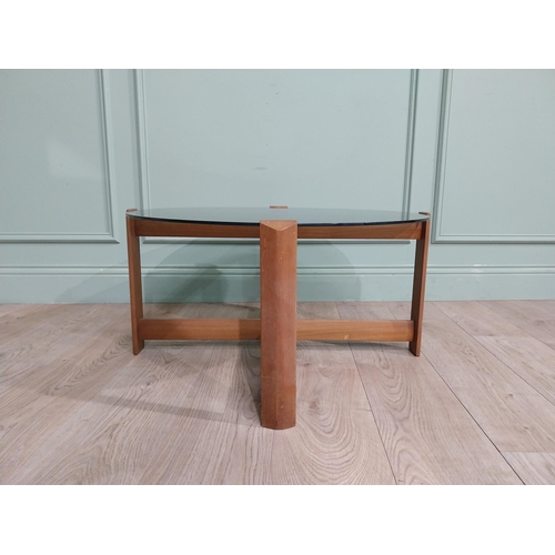 56 - Mid century teak and tinted glass coffee table. {37 cm H x 72 cm Dia.}.