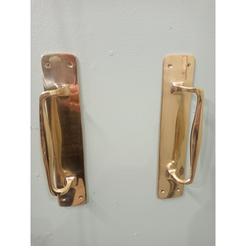 574 - Pair of solid brass door handles. {H 31cm x W 7cm x D 5cm}.  NOT AVAILABLE TO VIEW IN PERSON