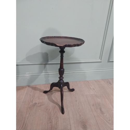 592 - Two Edwardian mahogany wine tables on turned columns and three outswept feet. {53 cm H x 31 cm Dia} ... 