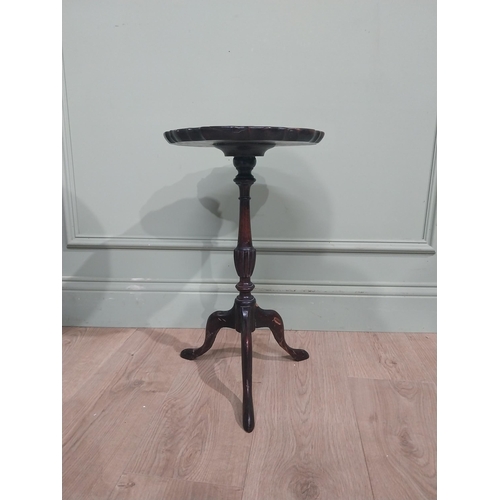 592 - Two Edwardian mahogany wine tables on turned columns and three outswept feet. {53 cm H x 31 cm Dia} ... 