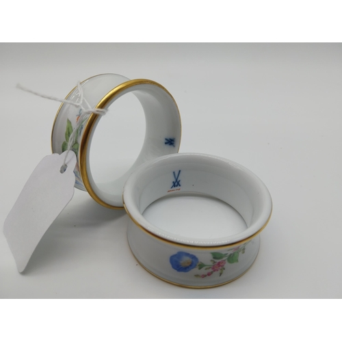 627 - Pair of 20th C. Meissen napkin rings with hand painted floral decoration. Underglazed with blue cros... 