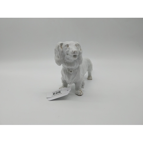 628 - 20th C. Meissen white glazed model of a Long-Haired Dachshund. Underglazed with blue crossed swords.... 