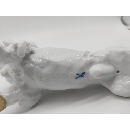 628 - 20th C. Meissen white glazed model of a Long-Haired Dachshund. Underglazed with blue crossed swords.... 