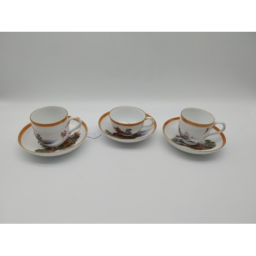 629 - Pair of early 19th C. Meissen Chocolate cups and saucers decorated with elaborate gilt borders, rura... 