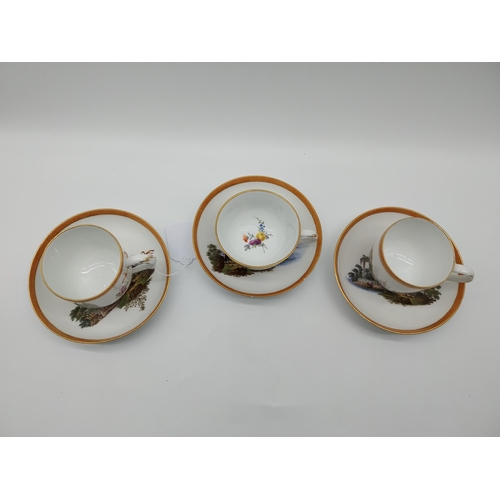 629 - Pair of early 19th C. Meissen Chocolate cups and saucers decorated with elaborate gilt borders, rura... 