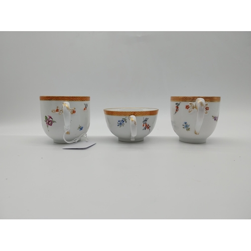 629 - Pair of early 19th C. Meissen Chocolate cups and saucers decorated with elaborate gilt borders, rura... 