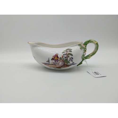 19th C. Meissen oval bourdalou � female chamber pot decorated with romantic scenes and the handle and stem embossed with flowers. Underglazed with blue crossed swords. {7.5 cm H x 20 cm L}.