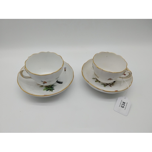 634 - Pair of 19th C. Cups and saucers decorated with Birds and Butterflies. Underglazed with blue crossed... 