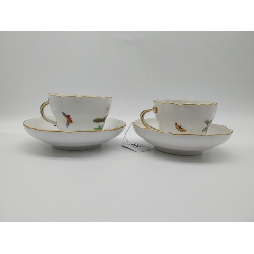 634 - Pair of 19th C. Cups and saucers decorated with Birds and Butterflies. Underglazed with blue crossed... 