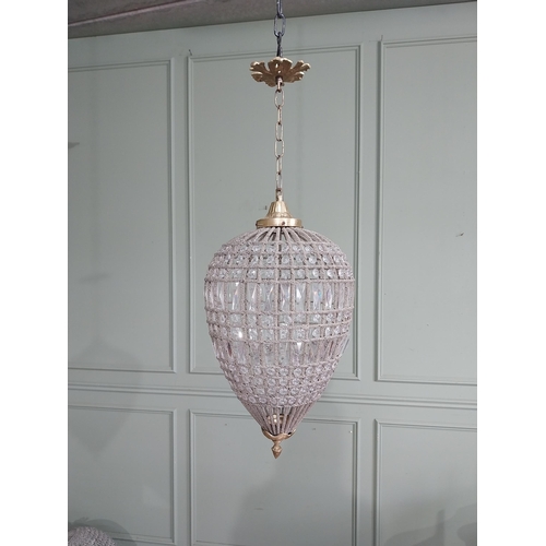 64 - French brass and cut crystal tear drop chandelier. {80 cm H x 29 cm Dia.}.