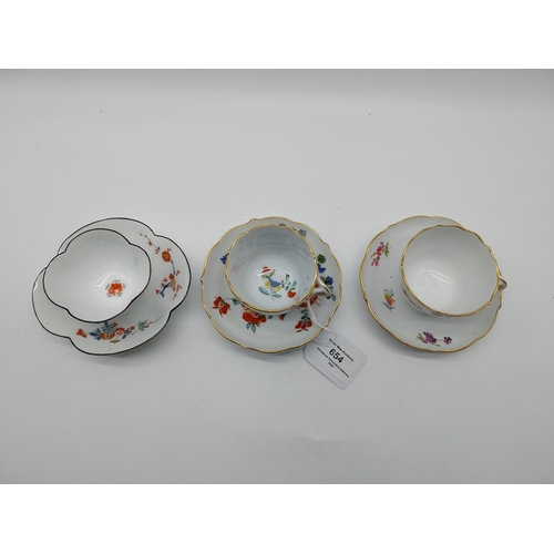 654 - Three 19th C. Meissen demitasse cup and saucer sets decorated with hand painted flowers and one with... 