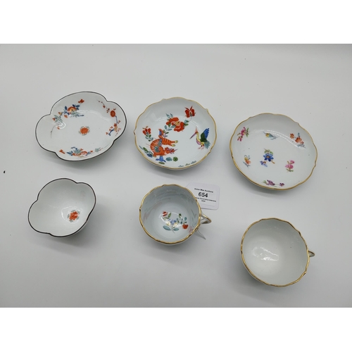 654 - Three 19th C. Meissen demitasse cup and saucer sets decorated with hand painted flowers and one with... 