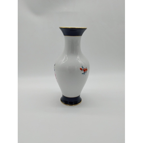 659 - 20th C. Meissen gilded blue ground and white vase decorated with hand painted bouquet of flowers. Un... 