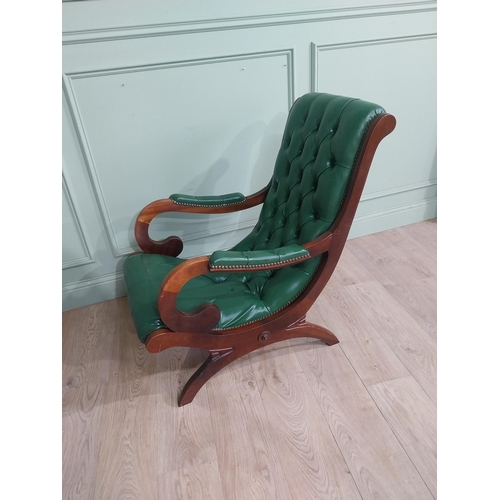 66 - 1950�s mahogany and leather upholstered armchair on lyre supports. {90 cm H x 63 cm W x 90 cm DD}.