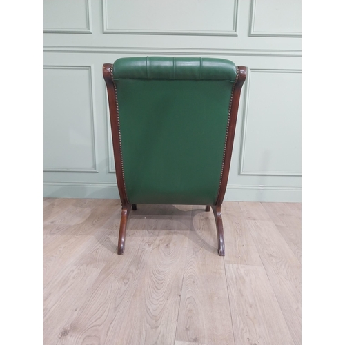 66 - 1950�s mahogany and leather upholstered armchair on lyre supports. {90 cm H x 63 cm W x 90 cm DD}.