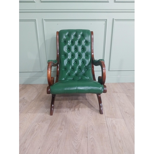 66 - 1950�s mahogany and leather upholstered armchair on lyre supports. {90 cm H x 63 cm W x 90 cm DD}.