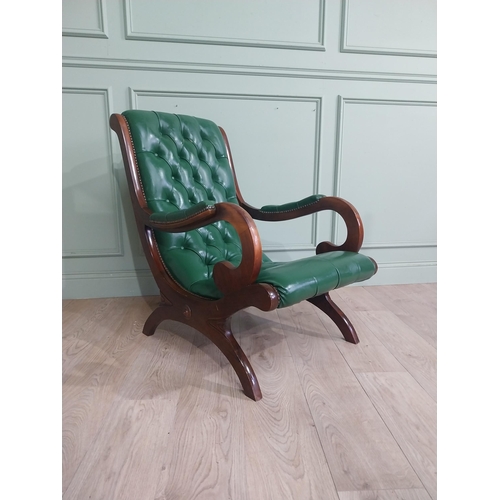 66 - 1950�s mahogany and leather upholstered armchair on lyre supports. {90 cm H x 63 cm W x 90 cm DD}.