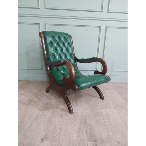 66 - 1950�s mahogany and leather upholstered armchair on lyre supports. {90 cm H x 63 cm W x 90 cm DD}.