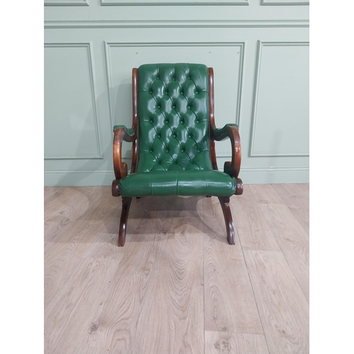 66 - 1950�s mahogany and leather upholstered armchair on lyre supports. {90 cm H x 63 cm W x 90 cm DD}.