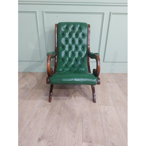 66 - 1950�s mahogany and leather upholstered armchair on lyre supports. {90 cm H x 63 cm W x 90 cm DD}.